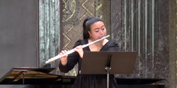 Undergraduate Lillie Kang plays the flute in competition